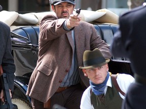 Kevin Wyville, left, and Dan Huggett prepare for a scene during a flim shoot in downtown Wallaceburg in September. The movie highlights the life of gangster Red Ryan, who was killed during a downtown liquor store robbery in Sarnia in 1936. May 23 marks the 80th anniversary of the shootout that left both of the robbers dead, as well as a Sarnia Police officer. The film is set to be screened Oct. 7 at Sarnia's Imperial theatre. (File photo/Postmedia Network)
