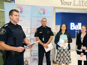 Staff Sgt. Marc Brunette, left, of the Greater Sudbury Police, makes a point at the launch of National Prescription Drug Drop-Off Day at Shoppers Drug Mart in the New Sudbury Centre in Sudbury, Ont. on Thursday May 19, 2016. John Lappa/Sudbury Star/Postmedia Network