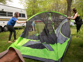 Hannah White, 12 helps her mom Samantha Fraser erect a tent on their site in Fanshawe Conservation Area in London on Friday.
Fraser says the family likes to camp a lot and often head out for the long weekend in May to start off the season.
Mike Hensen/The London Free Press/Postmedia Network