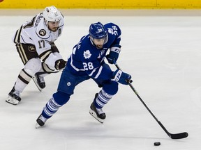 Toronto Marlies forward Mark Arcobello skates with puck against a Hershey Bears defender during Friday night's game. (HARVEY LEVINE PHOTO)