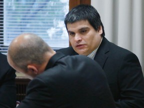 Russell Hogshooter, right, sits in the courtroom as he waits for jury selection to begin in his trial in Oklahoma City on Monday, May 16, 2016. Hogshooter and Denny Phillips are charged in the November 2009 death of 22-year-old Brooke Phillips, who had worked for a legal Nevada brothel featured on HBO, and three other people. (AP Photo/Sue Ogrocki)