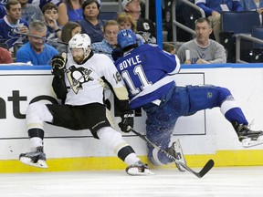 Pittsburgh Penguins forward Eric Fehr (16) and Tampa Bay Lightning forward Brian Boyle (11) collide during Game 4 of the Eastern Conference final Friday, May 20, 2016, in Tampa, Fla. (AP Photo/Chris O’Meara)