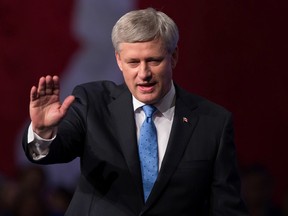 Stephen Harper waves as he leaves the stage after addressing supporters at an election night gathering in Calgary, Alta., on Monday October 19, 2015. THE CANADIAN PRESS/Darryl Dyck