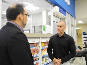 Star Staff photo
Pharmacist Sami Dabliz (right) explains to Sudbury MPP Glenn Thibeault how his profession can save the health-care system money and provide greater convenience for patients.