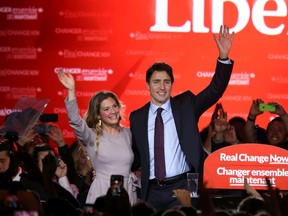 Justin Trudeau waves while accompanied by his wife Sophie Gregoire as he gives his victory speech after Canada's federal election in Montreal, Quebec on October 19, 2015. REUTERS/Chris Wattie