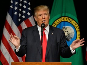 In this photo taken May 7, 2016, Republican presidential candidate Donald Trump speaks during a rally in Spokane, Wash. Donald Trump faces a struggle proving himself to white, suburban women, who could be crucial in the November general election.  (AP Photo/Ted S. Warren)