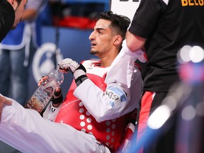 In this May 19, 2016 picture Belgium's Mourad Laachraoui  takes a break  during his fight against Spain's Jesus Tortosa Cabrera,  during their men -54kg final at the European Taekwondo Championships in Montreux, Switzerland.  (Daniel Mitchell/Keystone via AP)