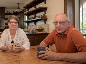 Tim, right, and Lucie Heins at the kitchen table in their energy-efficient home in Alberta Beach on Friday, May 13, 2016. - Photo by Yasmin Mayne
