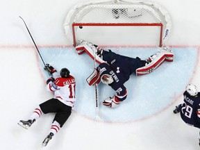 Brendan Gallagher of Canada scores a goal past goalkeeper Keith Kinkaid of the U.S. REUTERS/Grigory Dukor