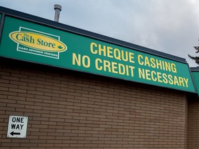 The Cash Store sign in Spruce Grove on Tuesday, Nov. 3, 2015. Payday loan companies may have to conform to new rules, including lower interest rates, if Bill 5: An Act to End Predatory Lending is passed. - File photo