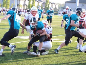 The Parkland Predators rumbled through the Battle River Shock on May 14 to capture the Capital District Minor Football Association’s Tier 3 midget football championship. - Photo by Mitch Goldenberg