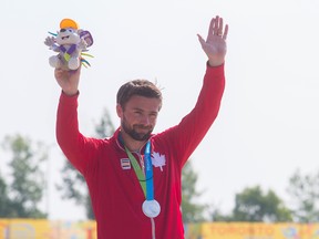 Canada's Mark Oldershaw waves to the crowd after accepting his silver medal in the  men's C1 1000-metre during the Pan Am Games at the Welland International Flatwater Centre on July 13, 2015. Oldershaw has yet to qualify for the Rio Olympics in August. (Julie Jocsak/Postmedia Network/Files)