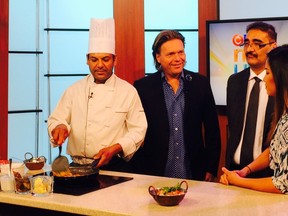 Former deputy premier Thomas Lukaszuk, second from left, Tariq Chaudhry, second from right, and a chef from Maharaja Hall, appear on CTV to promote their Monday night Red Cross fundraiser.