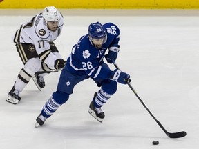 Marlies’ Mark Arcobello carries the puck as Bears’ Chris Bourqe gives chase. Arcobello notched his second goal of the playoffs. (HARVEY LEVINE/PENN LIVE)