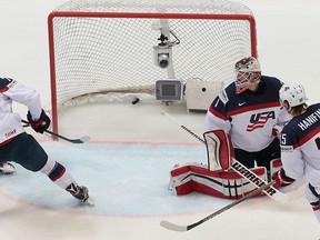 Russia’s Artemi Panarin, left, scores against Brady Skjei of the U.S. and goalie Keith Kinkaid during the Ice Hockey World Championships bronze medal match in Moscow, on Sunday, May 22, 2016. (AP Photo/Ivan Sekretarev)