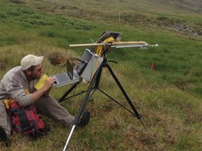 Scott Williamson collecting field measurements of albedo and spectral reflectance in southwest Yukon tundra during the summer of 2013.