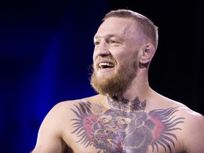 UFC featherweight champion Conor McGregor smiles during open workouts for UFC 196 at MGM Grand in Las Vegas March 2, 2016. (Associated Press)