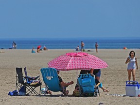 Toronto residents take to Woodbine Beach during the Victoria Day long weekend in Toronto on Sunday May 22, 2016. (Dave Abel/Toronto Sun)