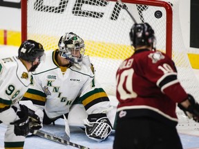 London Knights goalie Tyler Parsons, centre, looks back as a shot from Red Deer Rebels' Evan Polei goes wide during third period CHL Memorial Cup hockey action in Red Deer, Friday, May 20, 2016.THE CANADIAN PRESS/Jeff McIntosh