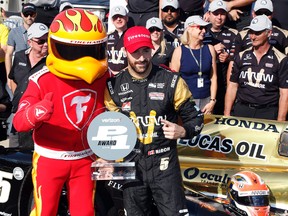 Verizon Indy Car driver James Hinchcliffe accepts the award after winning the pole as the fastest qualifier during qualifications for the Indianapolis 500 at Indianapolis Motor Speedway. (Brian Spurlock/USA TODAY Sports)