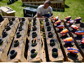 Eric Dagenais from Hands Fireworks is busy prepping the fireworks at Lansdowne park for the evening's show on Sunday, May 22, 2016. (James Park)