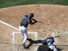 Christian Bethancourt of the San Diego Padres hits an RBI single during the fifth inning of a baseball game against the Los Angeles Dodgers at PETCO Park on May 22, 2016 in San Diego, California.  (Denis Poroy/Getty Images/AFP)
