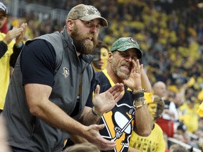 Pittsburgh Steelers former defensive end Brett Kiesel (left) and WWE former wrestler Shawn Michaels (right) react as the Pittsburgh Penguins host the Tampa Bay Lightning in game five of the Eastern Conference Final of the 2016 Stanley Cup Playoffs at the CONSOL Energy Center, May, 22, 2016. (Charles LeClaire-USA TODAY Sports)