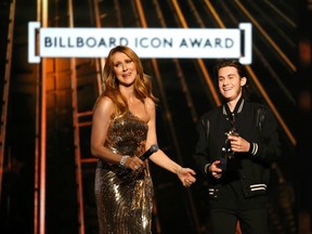 Billboard Icon Award recipient Celine Dion reacts as her son Rene Charles presents the award to her at the 2016 Billboard Awards in Las Vegas, Nevada, U.S., May 22, 2016.   REUTERS/Mario Anzuoni