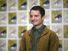 Actor Elijah Wood poses at a press line for "The Hunger Games: Mockingjay - Part 2" during the 2015 Comic-Con International Convention in San Diego, California July 9, 2015. REUTERS/Mario Anzuoni