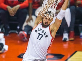 Jonas Valanciunas dunks against the Miami Heat. he could return to the Raptors lineup on Monday night.