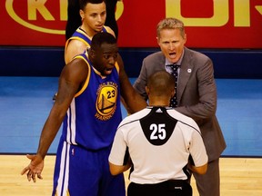Draymond Green and head coach Steve Kerr of the Golden State Warriors argue a call with referee Tony Brothers in the second quarter against the Oklahoma City Thunder in game three of the Western Conference Finals during the 2016 NBA Playoffs at Chesapeake Energy Arena on May 22, 2016 in Oklahoma City, Oklahoma. (J Pat Carter/Getty Images/AFP)