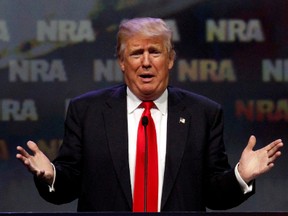 Republican presidential candidate Donald Trump addresses members of the National Rifle Association's during their NRA-ILA Leadership Forum during their annual meeting in Louisville, Kentucky, U.S., May 20, 2016. REUTERS/John Sommers II