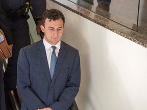 Johnny Manziel leaves the courtroom after he makes his first appearance at the Frank Crowley Courts Building on his misdemeanor assault charge.  (Jerome Miron/USA TODAY Sports)