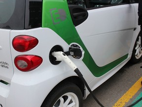 Jay Heaman, manager of operations at Woodstock Hydro, drives a smart electric car. Woodstock Hydro has also linked electric vehicle chargers and battery storage to the Whites Lane MicroGrid in Woodstock, Ont. on April 23, 2015. (Megan Stacey/Woodstock Sentinel-Review/Postmedia Network)