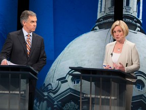 Progressive Conservative Leader Jim Prentice, and NDP leader Rachel Notley, speak during the televised debate in the Global television studio on April 23, 2015 in Edmonton.