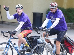 Paul Harrison (left) and Richard Stephens arrive at The Forks in Winnipeg, Man.  Monday, May 23, 2016 after cycling from Wichita, Kansas to raise money to combat Alzheimers. (Brian Donogh/Winnipeg Sun/Postmedia Network)