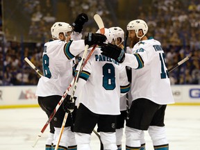 Sharks centre Tomas Hertl (left) celebrates with his teammates after a goal during the first period in Game 5 of the NHL's Western Conference final against the Blues in St. Louis on Monday, May 23, 2016. (Jeff Roberson/AP Photo)