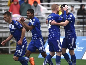 FC Edmonton Daryl Fordyce (16) celebrates with Adam Eckersley (44) after scoring on a penalty kick against the Carolina RailHawks which turned out to be the winning goal during NASL at Clarke Field in Edmonton, May 22, 2016.