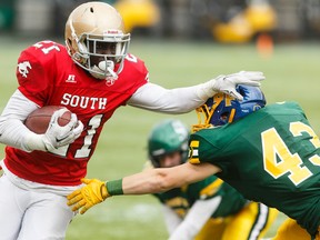 South's Ted Kubongo (left) pushes away North's Isiah Brown during the second half of the 2016 Football Alberta Senior Bowl at Commonwealth Stadium in Edmonton, Alta., on Monday May 23, 2016.