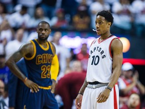 Raptors' DeMar DeRozan (right) and Cavaliers' LeBron James (left) look on during first half action in Game 4 of the Eastern Conference final in Toronto on Monday, May 23, 2016. (Ernest Doroszuk/Toronto Sun)