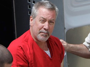 In this May 8, 2009 file photo, former Bolingbrook, Ill., police officer Drew Peterson arrives for court in Joliet, Ill. (AP Photo/M. Spencer Green, File)