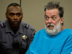 In this Dec. 9, 2015 file photo, Robert Lewis Dear talks to Judge Gilbert Martinez during a court appearance in Colorado Springs, Colo.  (Andy Cross/The Denver Post via AP, Pool, File)