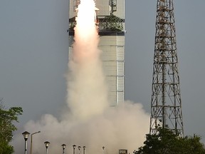 This handout photograph taken and released by The Indian Space Research Organization (ISRO) on May 23, 2016, shows a scale version of a "Reusable Launch Vehicle" or RLV-TD as it is launched from Sriharikota on the south-east coast of India.  (AFP PHOTO/ISRO)
