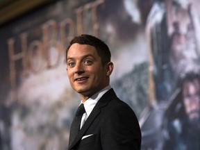 Actor Elijah Wood poses at the premiere of "The Hobbit: The Battle of the Five Armies" at Dolby theatre in Hollywood, California December 9, 2014. The movie opens in the U.S. on December 17.   REUTERS/Mario Anzuoni