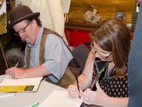 Curator Farley Wuth and photographer Jessica Maunsell signed copies of the newly released photo book at the book launch on Tuesday evening. | Caitlin Clow Photos/Pincher Creek Echo