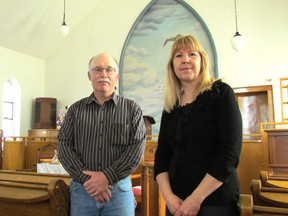 Keith McManus and Cathy Young stand on Friday May 20, 2016 in the chapel at Mandaumin United Church in Plympton-Woming, Ont. The church's final service, before it closes, is set for June 26. The congregation has been active for 161 years. (Paul Morden/Sarnia Observer/Postmedia Network)