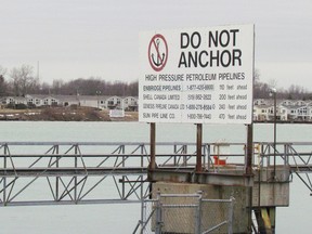 A sign pointing out the location of Enbridge and other pipelines on the St. Clair River near Corunna is shown in this file photo. A U.S. Coast Guard-led exercise simulating the discharge of oil from a pipeline in the river is scheduled for Wednesday. Several Canadian agencies will also be taking part in the drill. (File photo/Sarnia Observer/Postmedia Network)