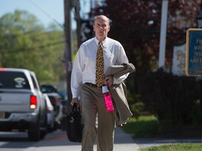 Calvin Harris enters Schoharie County Court prior to closing arguments during his fourth trial in Schoharie, N.Y., on Wednesday, May 18, 2016. The prosecutor in the case of Harris, a wealthy New York man being tried a fourth time in the 2001 death of his estranged wife says the defendant was consumed with fear. (Andrew Thayer/Press & Sun-Bulletin via AP)