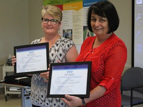 Tracy Rogers, of the Sarnia Lambton Coordinating Committee on Violence Against Women, presented a certificate of recognition to Lambton County Warden Bev MacDougall Tuesday afternoon. County officials announced Tuesday all of the county's 1,200 workers will be trained on the warning signs of domestic violence and available community resources by the end of this year. Barbara Simpson/Sarnia Observer/Postmedia Network