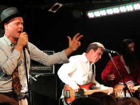 Gord Downie, left, Gord Sinclair and Rob Baker of The Tragically Hip perform at The Supermarket restaurant and bar in Toronto after aunching their new album Now For Plan A in 2012. (Ian MacAlpine/The Whig-Standard)